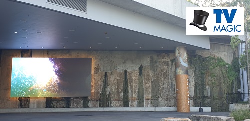 an outdoor digital art work display with TV Magic logo in bottom right corner