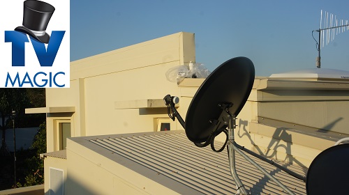 satellite dish on a tile roof of a building