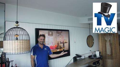 technician with a wall mounted TV in the W hotel