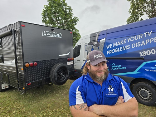 Technician - Nick in front of a caravan