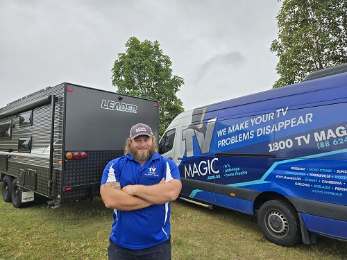 Technician - Nick with TV Magic van next to a caravan
