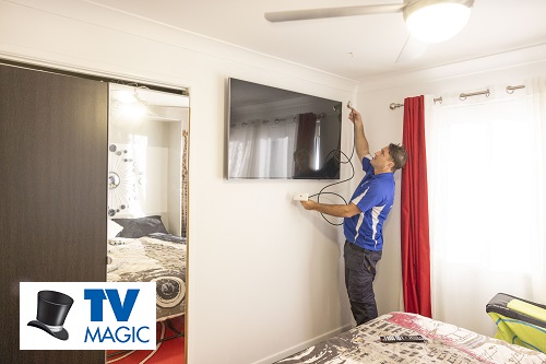 Technician preparing to install a TV point for a new TV installation.