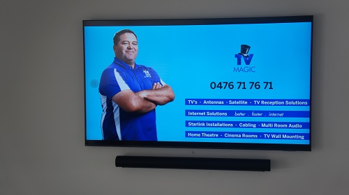 A TV with technician - Darrel on screen, along with his services.