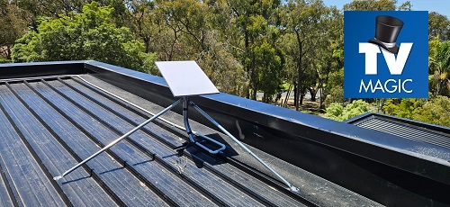 Starlink dish on a tin roof with TV Magic logo