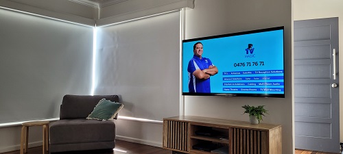 A client TV entertainment area - Darrel on TV screen displaying his services