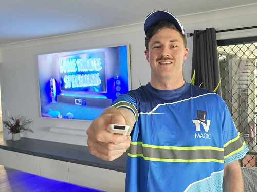 Technician pointing a TV remote