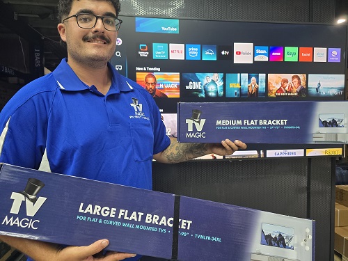Technician holding TV Magic wall brackets