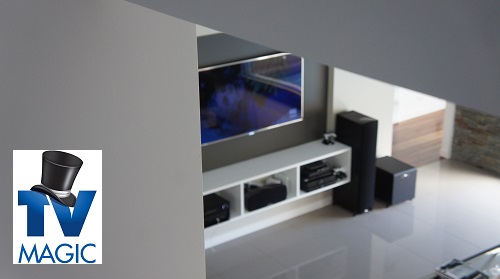 a wall mounted TV in a living room from an aerial angle