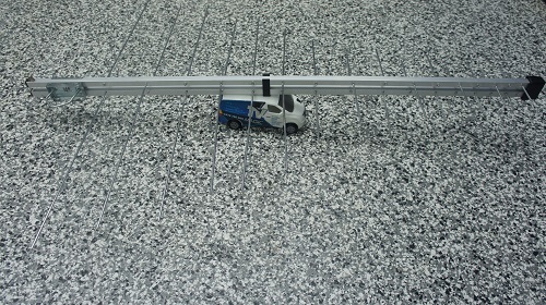 An aerial on top of a mini TV Magic van