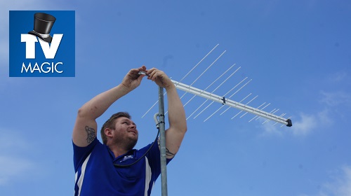 Technician installing a new antenna