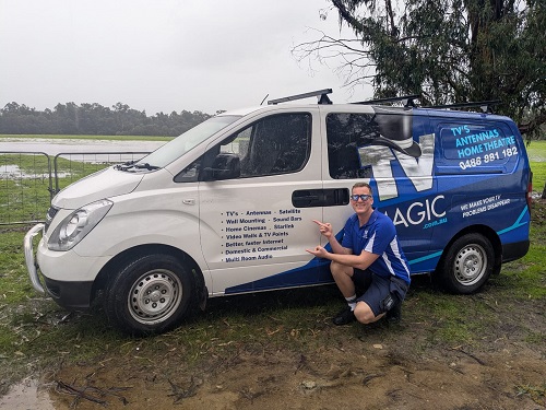 Technician - Lucas, next to his van, showing off his services.