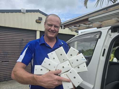 Technician holding multiple TV points