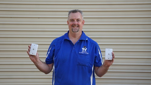 Technician holding up two TV points