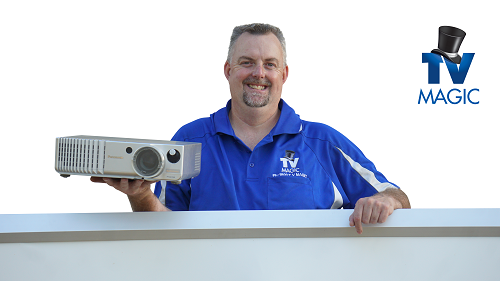 technician = Anton with a projector ready for installation