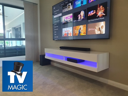 an angular picture of a wall mounted TV with soundbar. TV Magic logo in bottom left corner