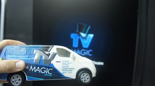Mini TV Magic van in front of a large TV installation