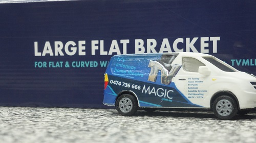 Mini TV Magic van in front of a wall bracket.