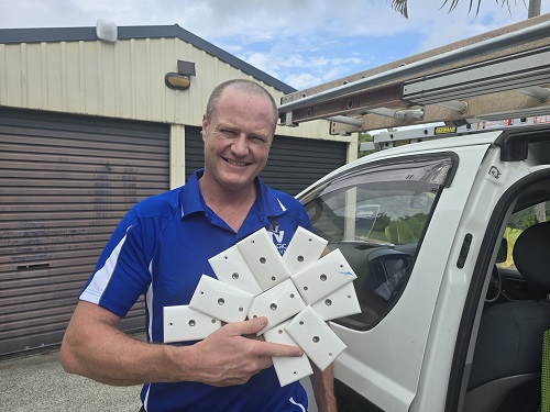 Technician holding many TV points