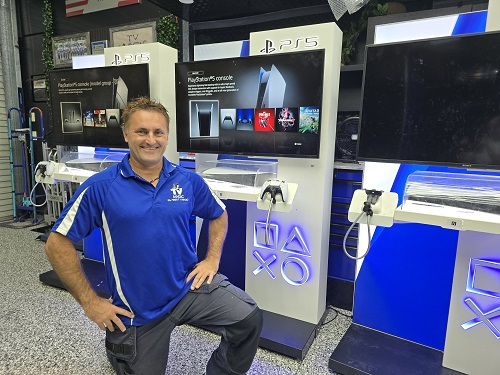 Technician in front of a commercial gaming console station