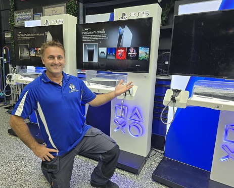 Technician in front of a commercial PlayStation setup