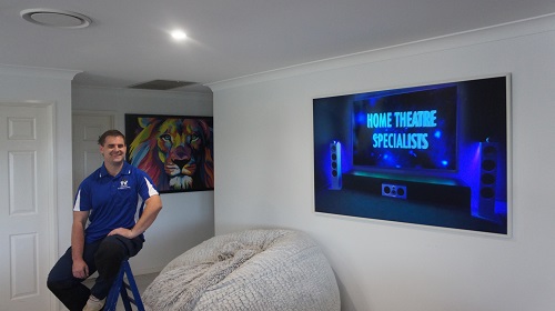 Technician in front of a large screen