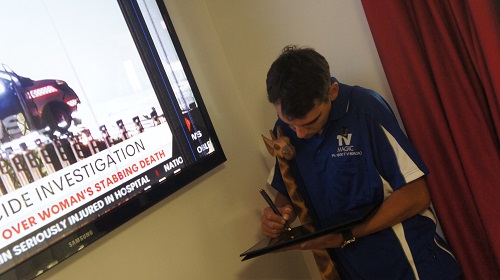 Technician working on a TV insurance repair assessment