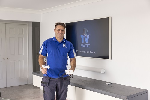 Technician holding a TV point