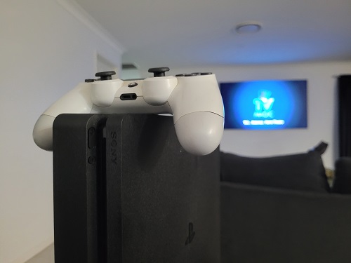 Gaming console in front of large TV