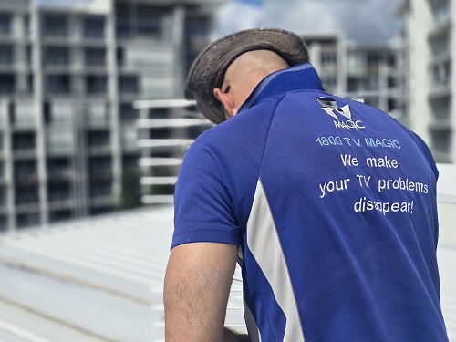 Technician wearing his TV Magic shirt