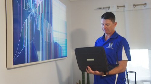 Technician with broken TV