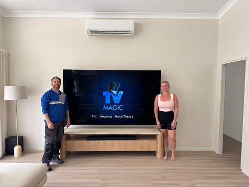 Big TV with happy customer