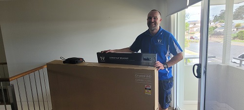 Technician Vaughan with a delivery for a local customer