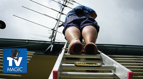 a technician up on a ladder