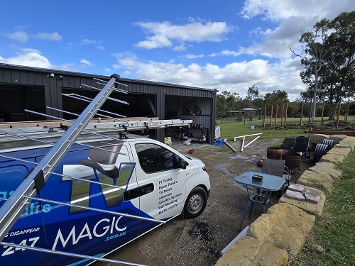 Antenna held up in front of TV Magic van