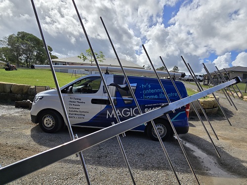 Antenna in front of TV Magic van out the front of customer home