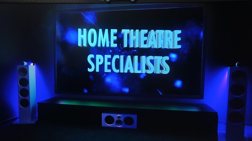 Large screen that says "Home Theatre Specialists"