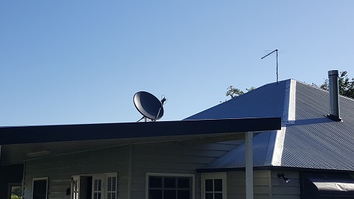 Roof view of customers home with satellite dish installation by TV Magic
