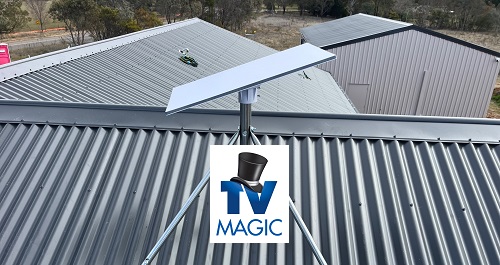 Starlink dish installed on a tin roof with TV Magic logo