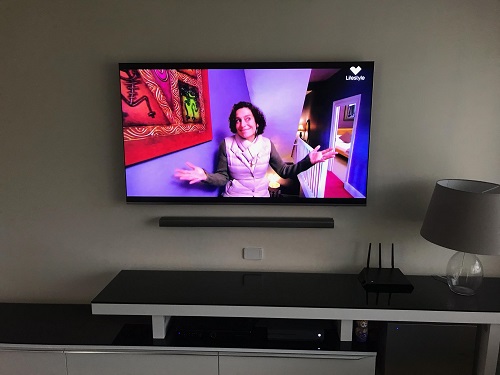 A TV Magic wall mounted TV with soundbar
