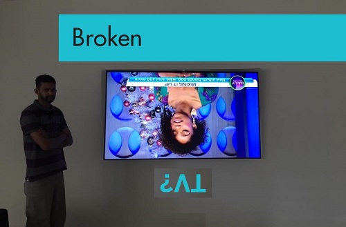 An upside down TV with caption "Broken?" up above it