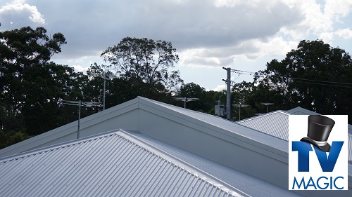 a TV aerial installation on a tin roof with a TV Magic logo in bottom right corner