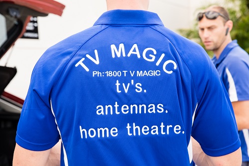 Technician - Paul, showing the back of his TV Magic shirt.