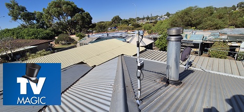 Antenna installation by TV Magic. Caption at bottom - TV's, antennas, home theatre