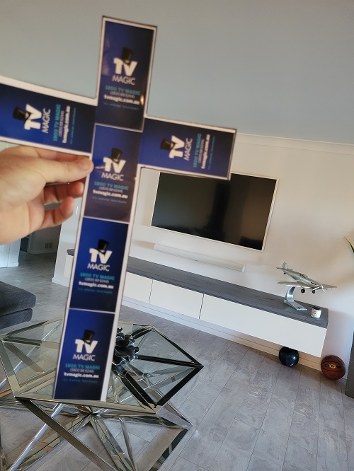 TV Magic cross in front of a TV setup by TV Magic