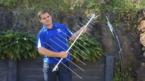 Technician holding an antenna
