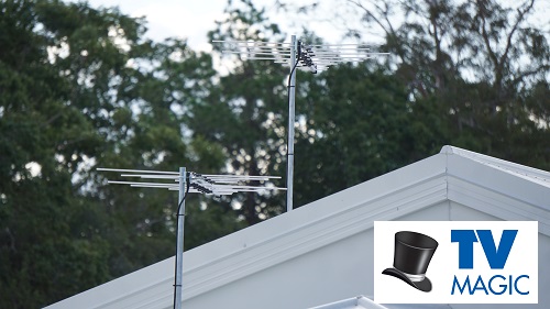 antennas on a tin roof with a TV Magic logo included