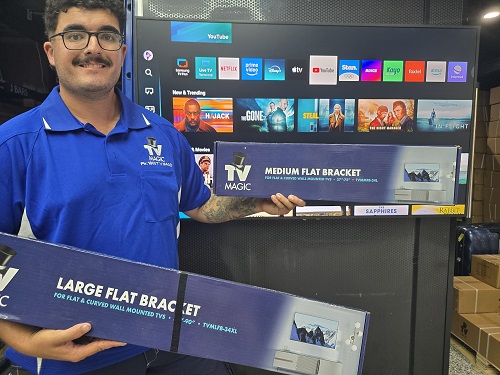 Technician holding TV Magic wall mounting bracketsra
