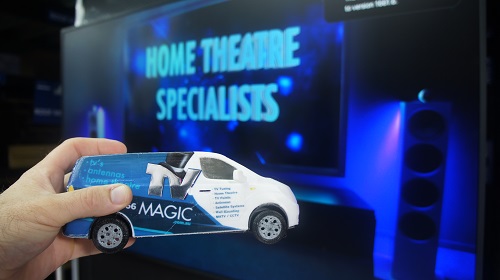 Mini TV Magic van in front of large screen