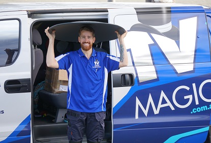 Technician with a satellite dish above his head