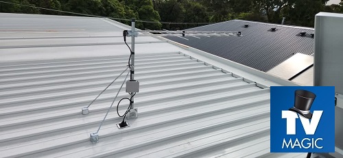 An antenna on a tin roof with TV Magic logo in bottom right corner
